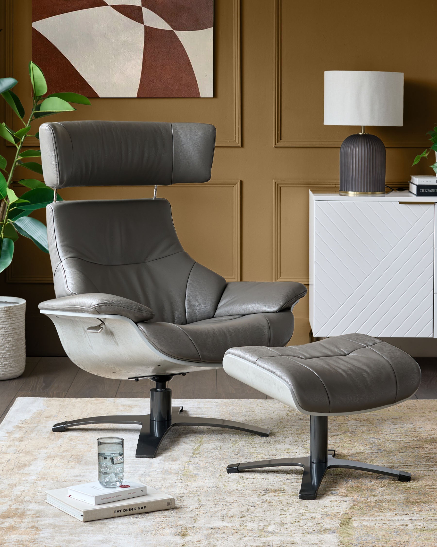 Fauteuil inclinable pivotant Karma en cuir gris foncé avec repose-pieds