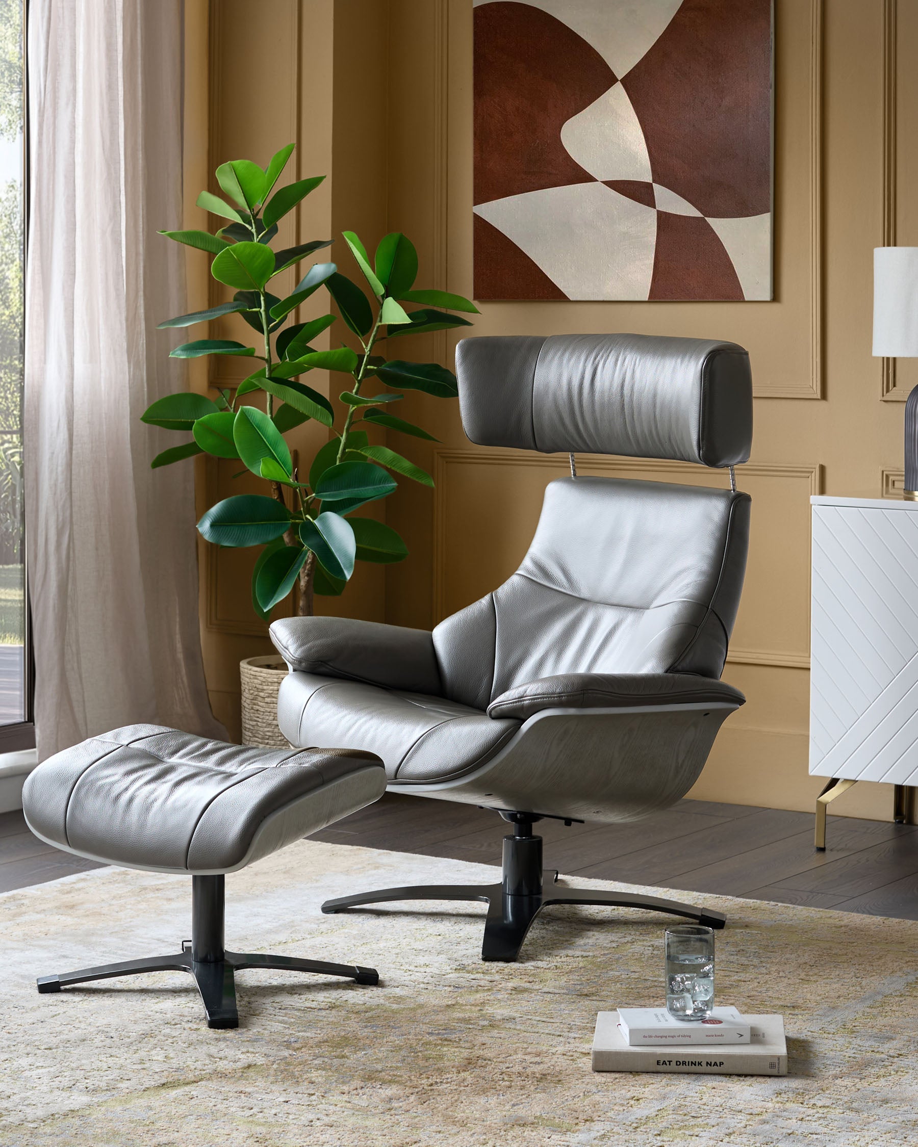 Fauteuil inclinable pivotant Karma en cuir gris foncé avec repose-pieds