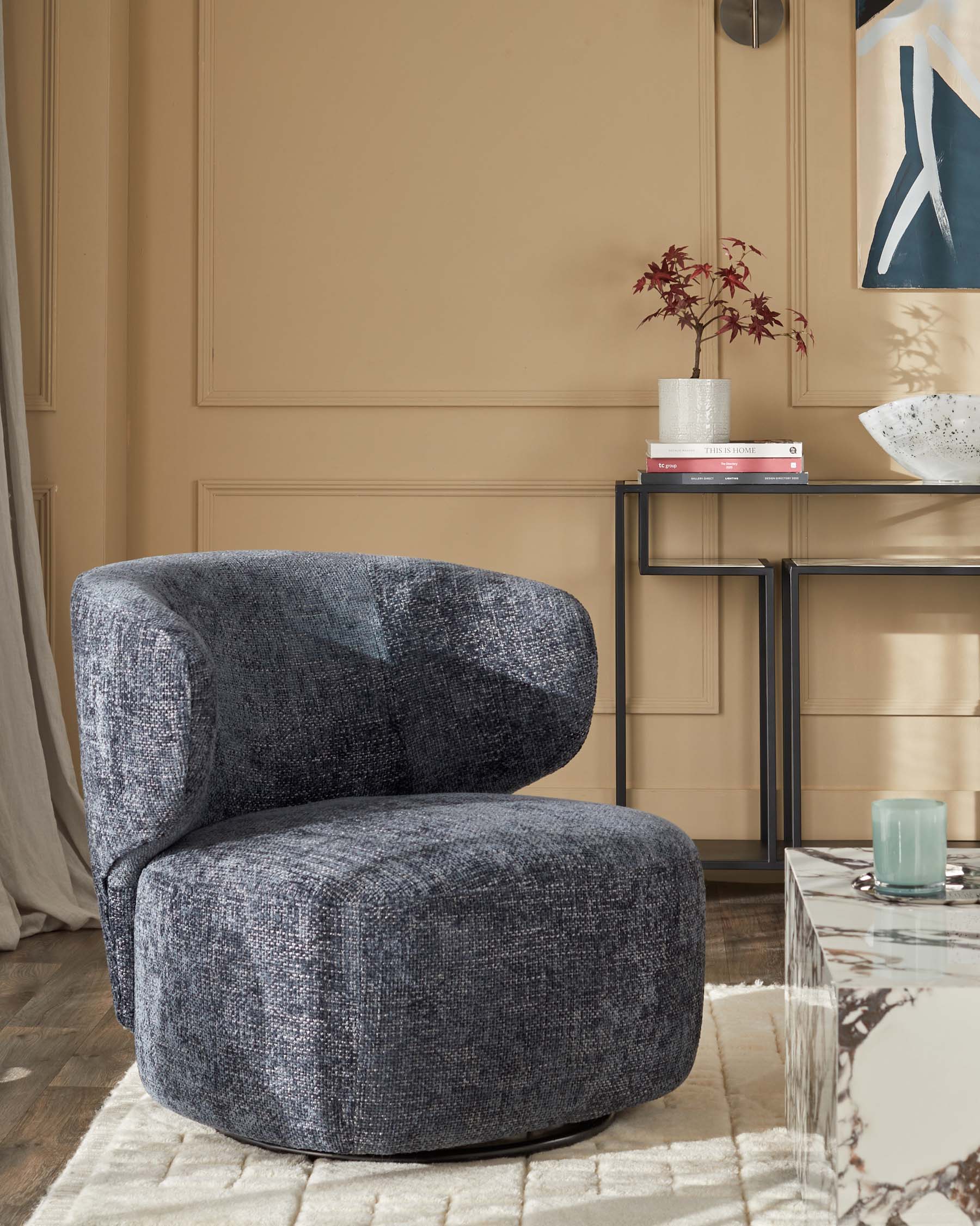 Fauteuil pivotant Landon en tissu bleu foncé