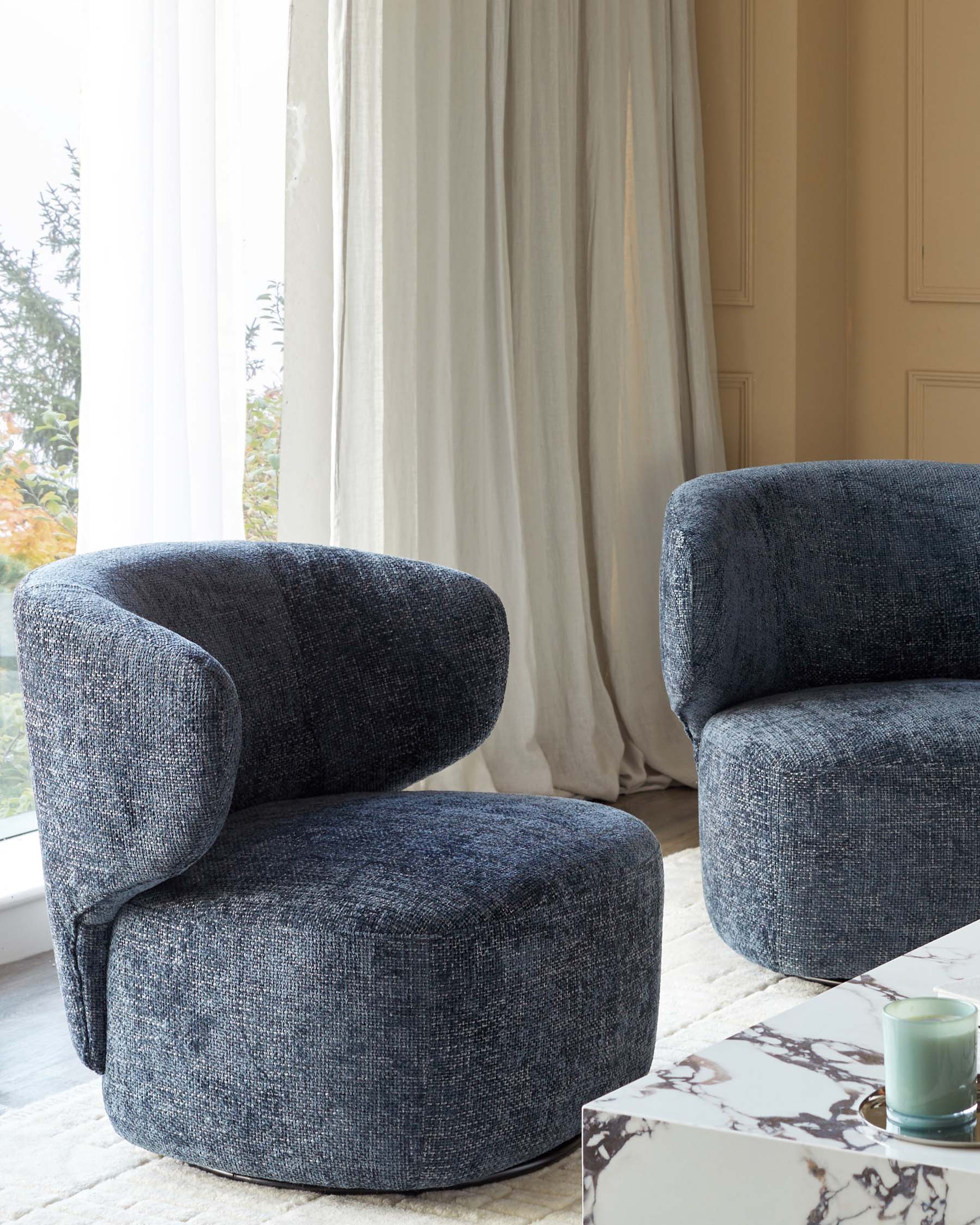 Fauteuil pivotant Landon en tissu bleu foncé